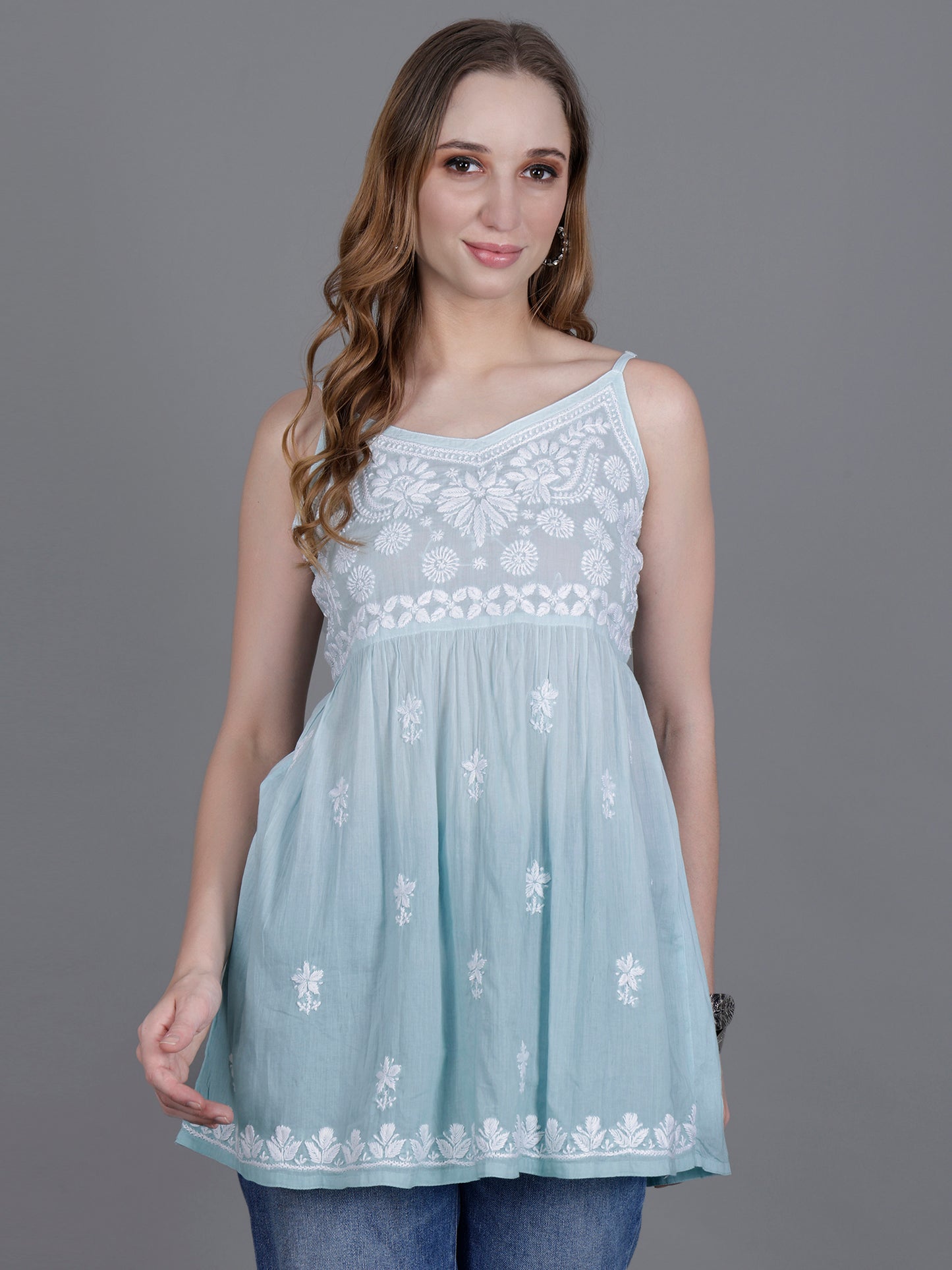 The Chikankari Story Handcrafted Sleeveless Chikankari Mul Cotton Top with Intricate White Floral Embroidery in Ombre Shades – Light Blue, Sea Green, Light Peach, Light Purple, Light Pink & Light Yellow.