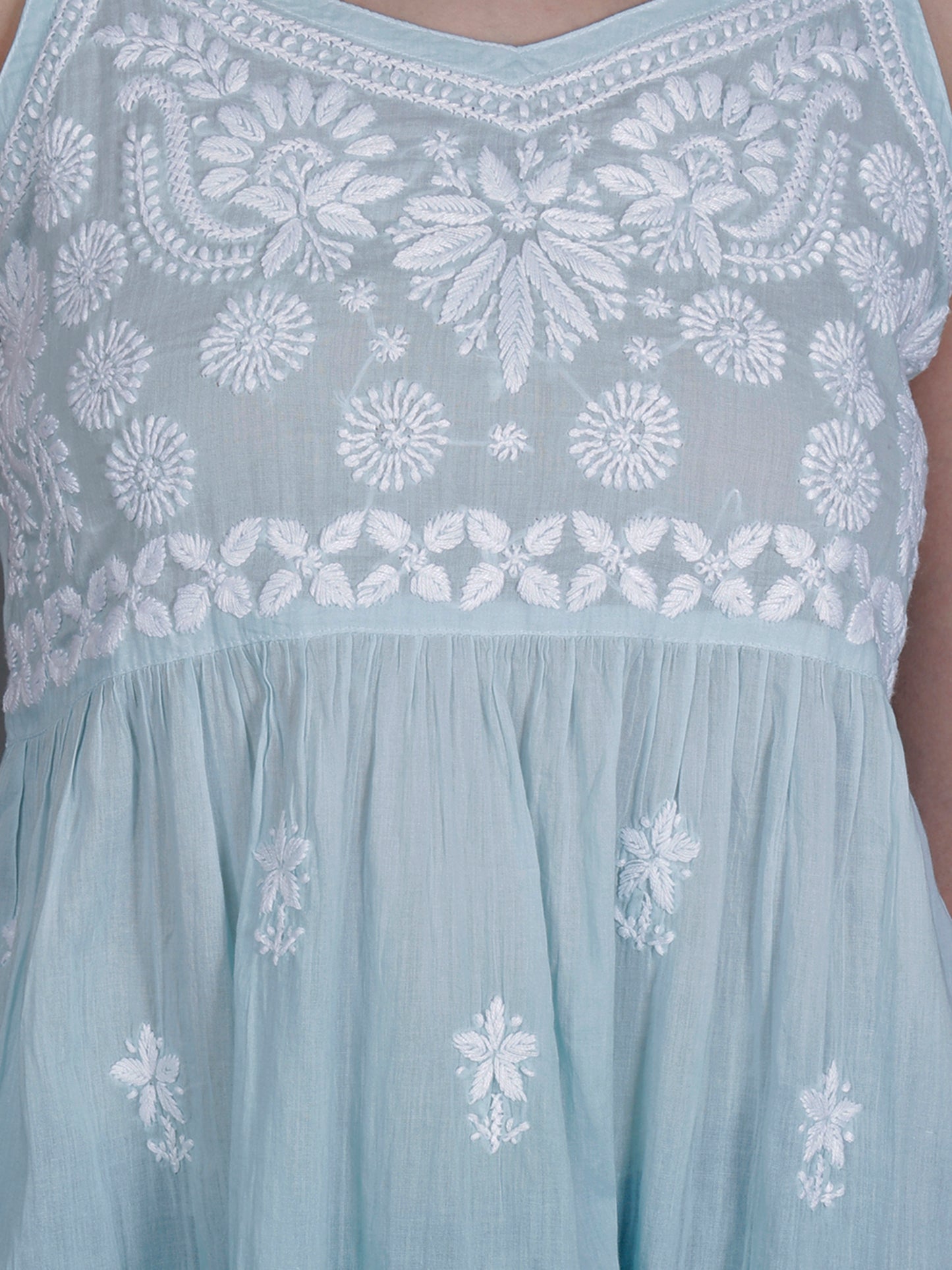The Chikankari Story Handcrafted Sleeveless Chikankari Mul Cotton Top with Intricate White Floral Embroidery in Ombre Shades – Light Blue, Sea Green, Light Peach, Light Purple, Light Pink & Light Yellow.