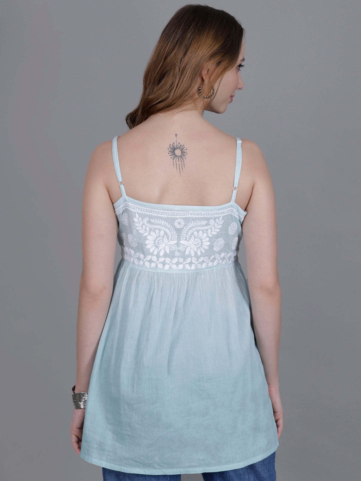 The Chikankari Story Handcrafted Sleeveless Chikankari Mul Cotton Top with Intricate White Floral Embroidery in Ombre Shades – Light Blue, Sea Green, Light Peach, Light Purple, Light Pink & Light Yellow.