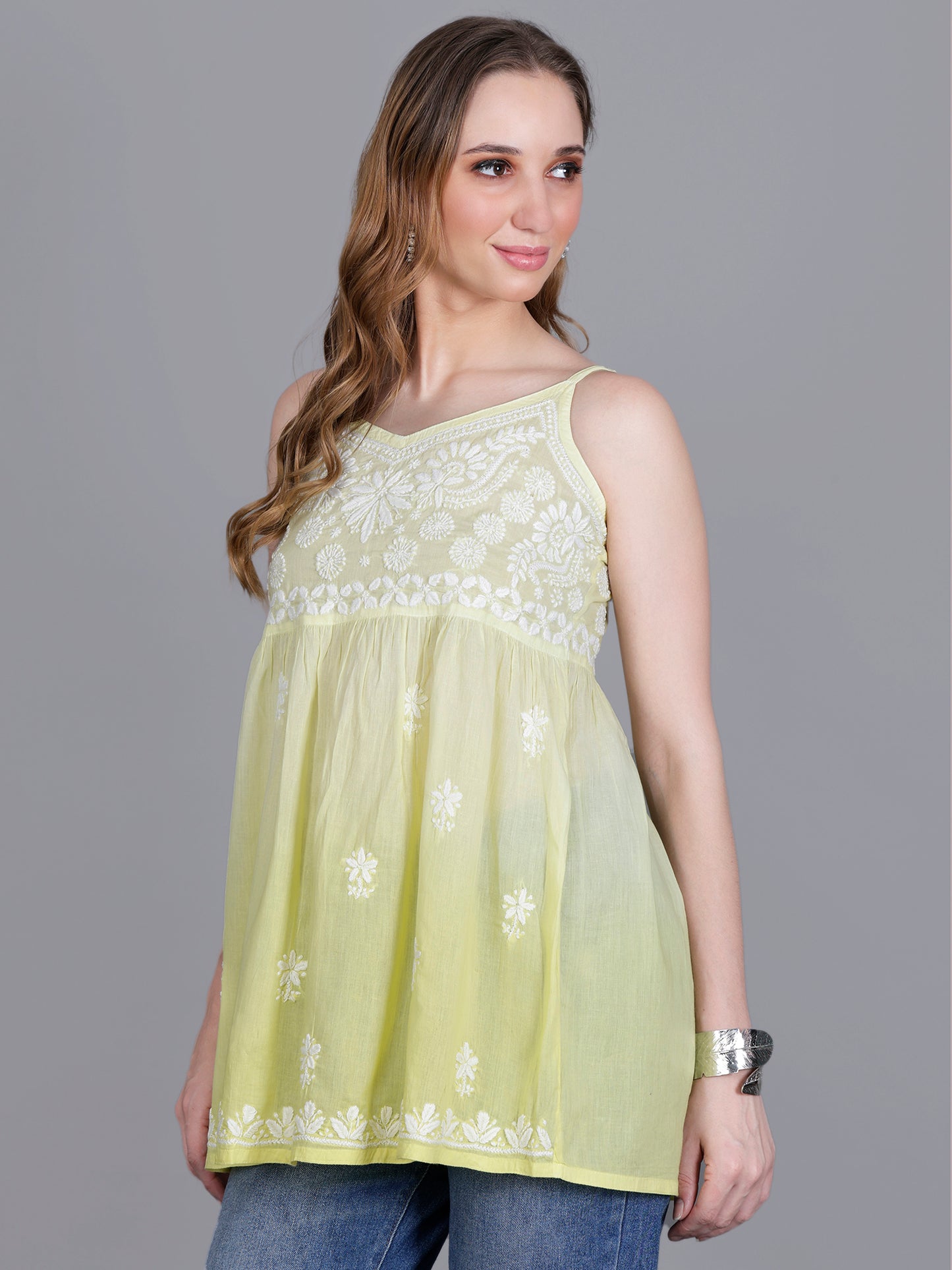 The Chikankari Story Handcrafted Sleeveless Chikankari Mul Cotton Top with Intricate White Floral Embroidery in Ombre Shades – Light Blue, Sea Green, Light Peach, Light Purple, Light Pink & Light Yellow.
