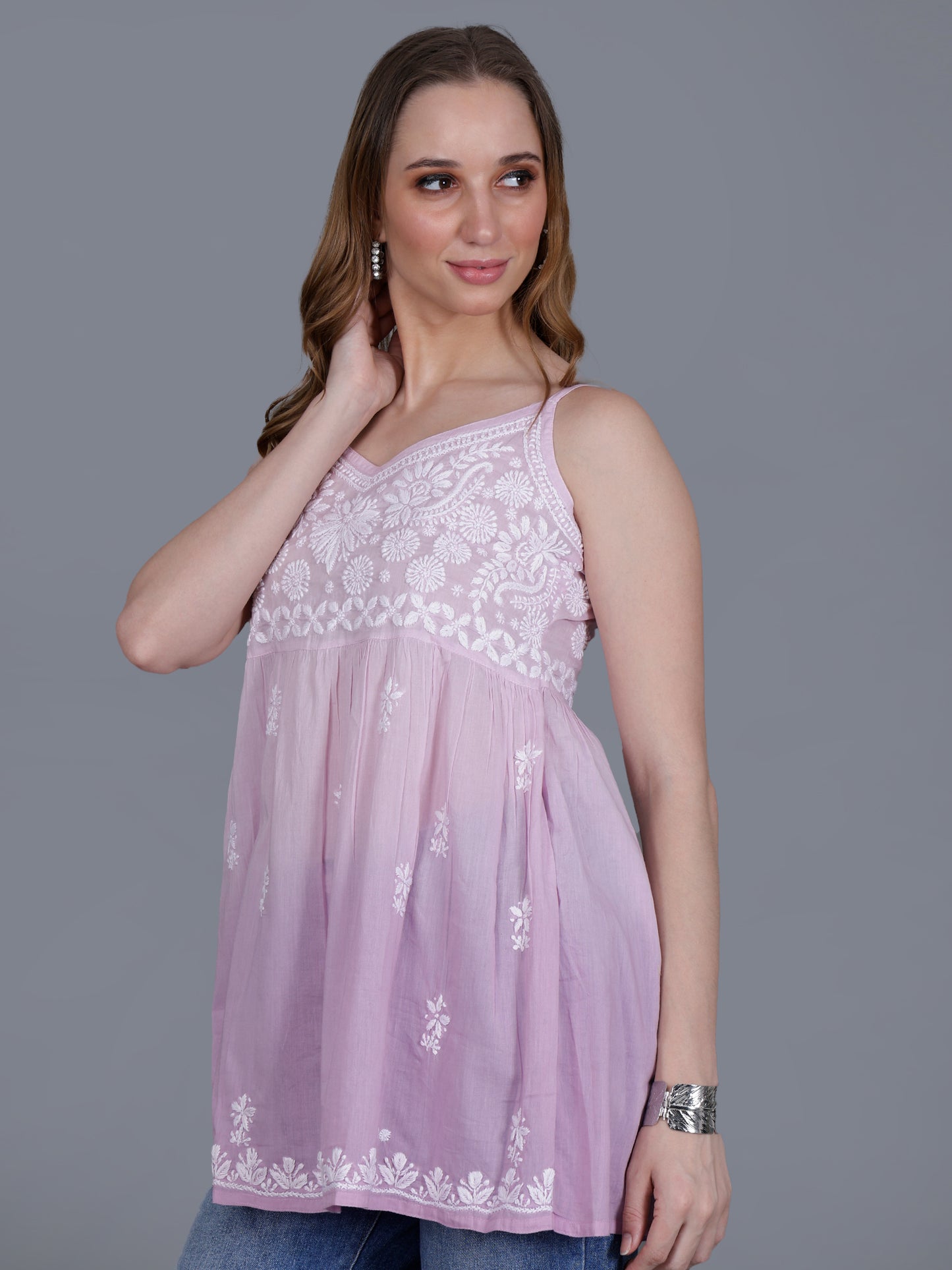 The Chikankari Story Handcrafted Sleeveless Chikankari Mul Cotton Top with Intricate White Floral Embroidery in Ombre Shades – Light Blue, Sea Green, Light Peach, Light Purple, Light Pink & Light Yellow.