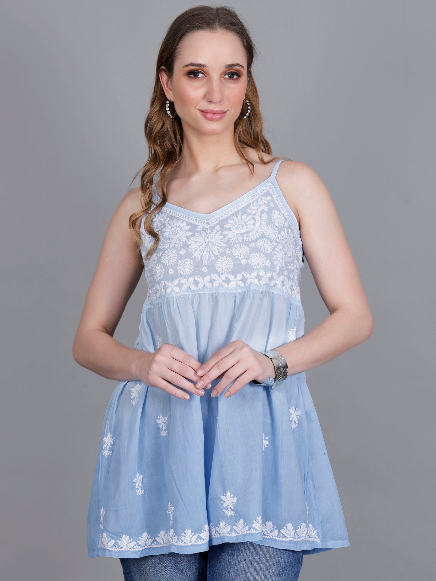 The Chikankari Story Handcrafted Sleeveless Chikankari Mul Cotton Top with Intricate White Floral Embroidery in Ombre Shades – Light Blue, Sea Green, Light Peach, Light Purple, Light Pink & Light Yellow.