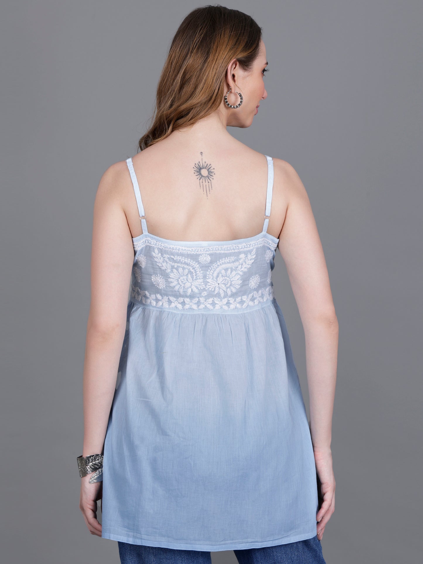 The Chikankari Story Handcrafted Sleeveless Chikankari Mul Cotton Top with Intricate White Floral Embroidery in Ombre Shades – Light Blue, Sea Green, Light Peach, Light Purple, Light Pink & Light Yellow.