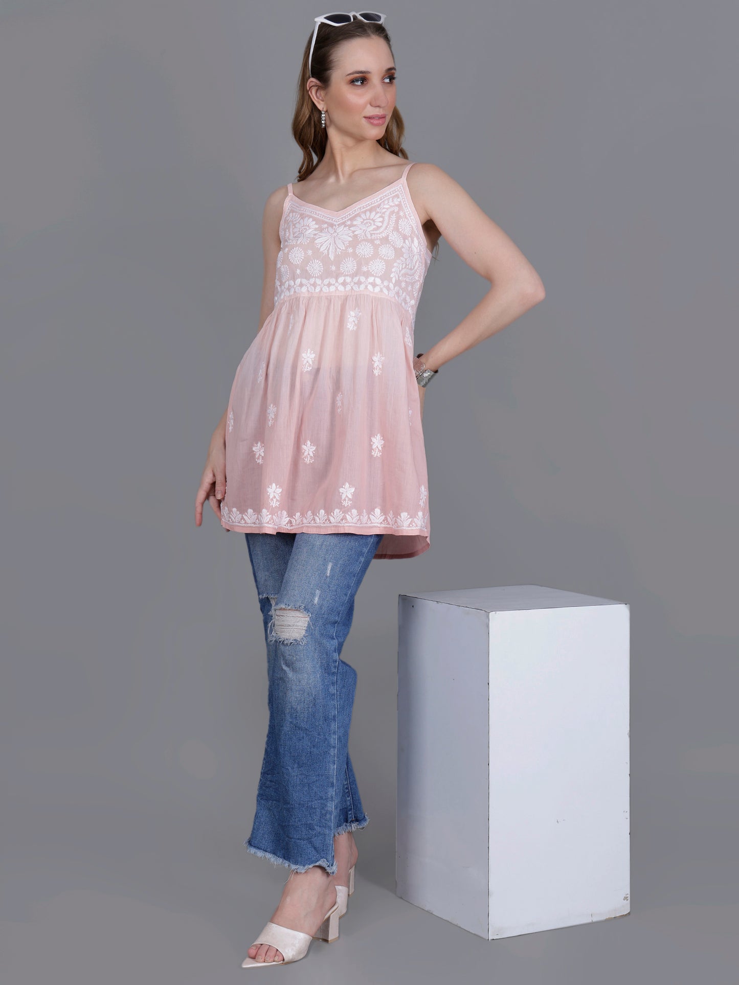 The Chikankari Story Handcrafted Sleeveless Chikankari Mul Cotton Top with Intricate White Floral Embroidery in Ombre Shades – Light Blue, Sea Green, Light Peach, Light Purple, Light Pink & Light Yellow.