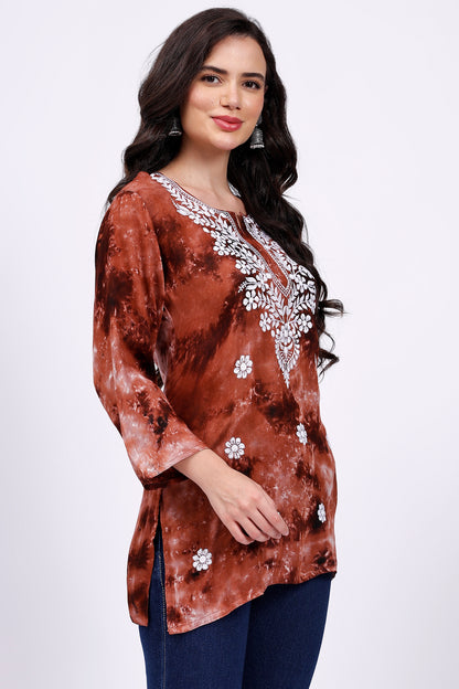 The Chikankari Story Embroidered Rayon Tie-Dyed Chikankari Brown short Kurti with 3D Embroidery.