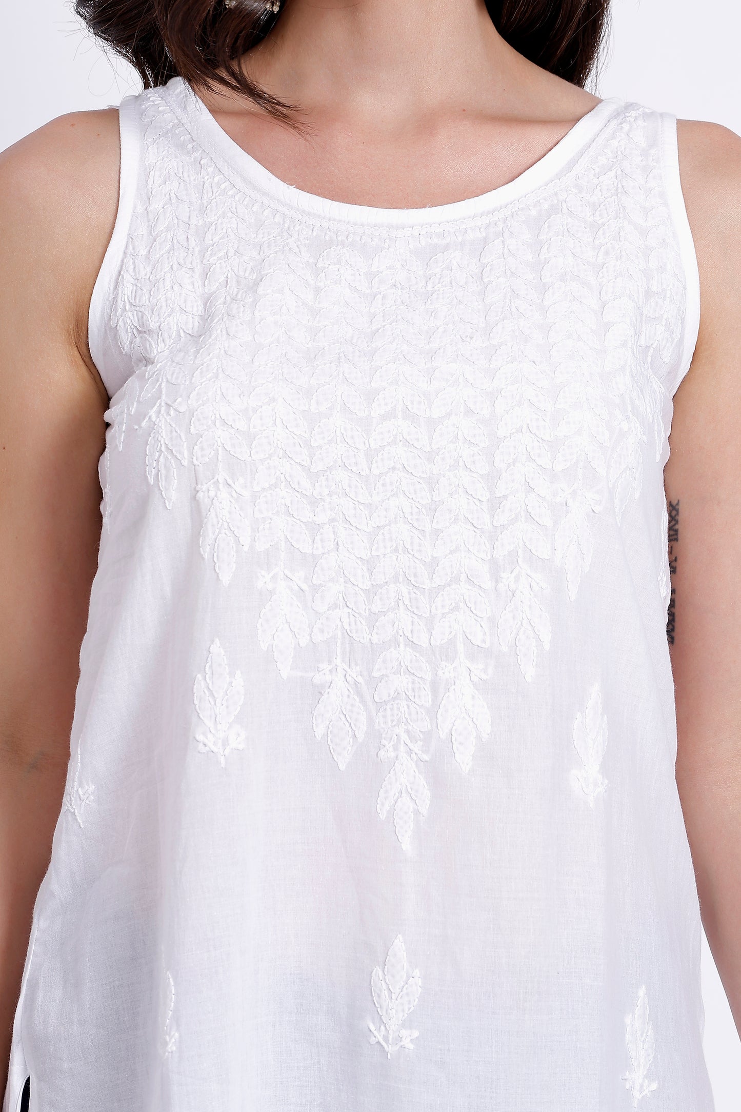 The Chikankari Story White Sleeveless Chikankari Top and Tunic with Hand Embroidery – Lakhnavi Bakhiya and Thread Work.