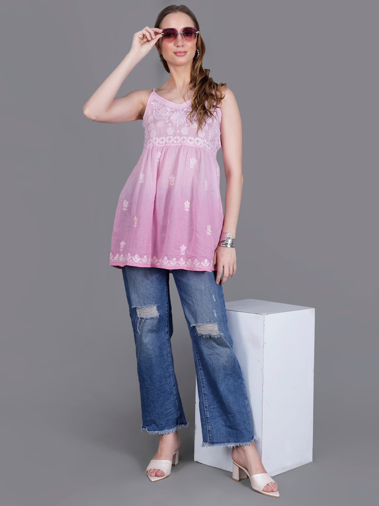 The Chikankari Story Handcrafted Sleeveless Chikankari Mul Cotton Top with Intricate White Floral Embroidery in Ombre Shades – Light Blue, Sea Green, Light Peach, Light Purple, Light Pink & Light Yellow.