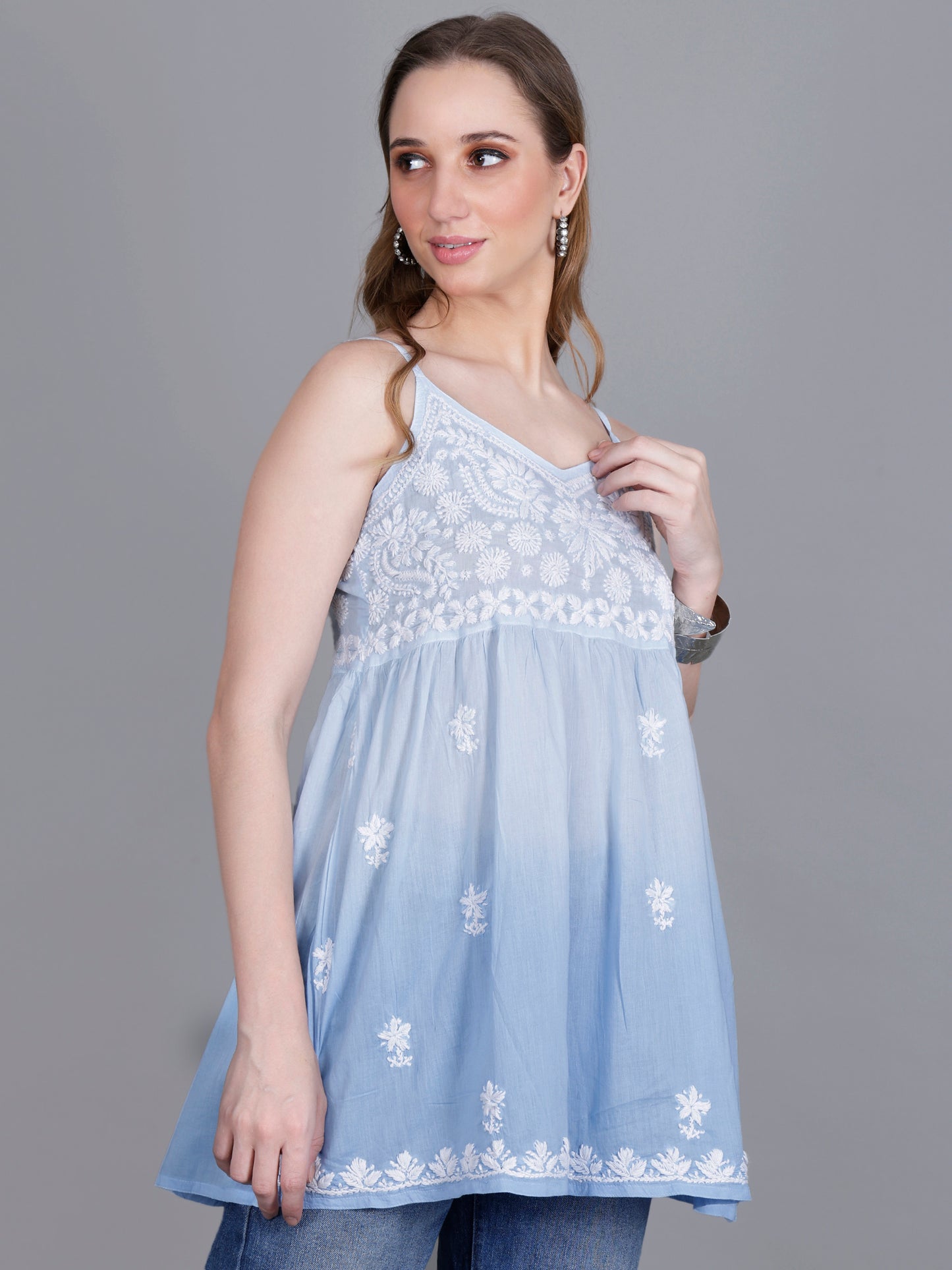 The Chikankari Story Handcrafted Sleeveless Chikankari Mul Cotton Top with Intricate White Floral Embroidery in Ombre Shades – Light Blue, Sea Green, Light Peach, Light Purple, Light Pink & Light Yellow.