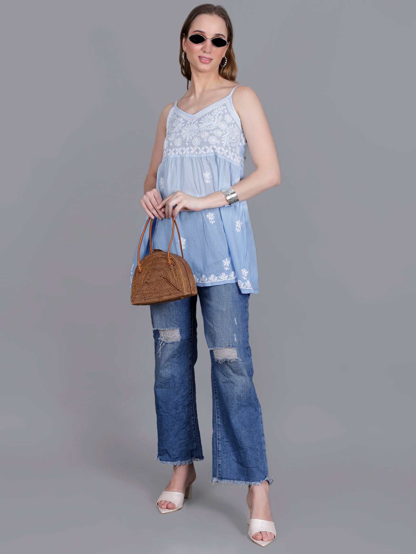 The Chikankari Story Handcrafted Sleeveless Chikankari Mul Cotton Top with Intricate White Floral Embroidery in Ombre Shades – Light Blue, Sea Green, Light Peach, Light Purple, Light Pink & Light Yellow.
