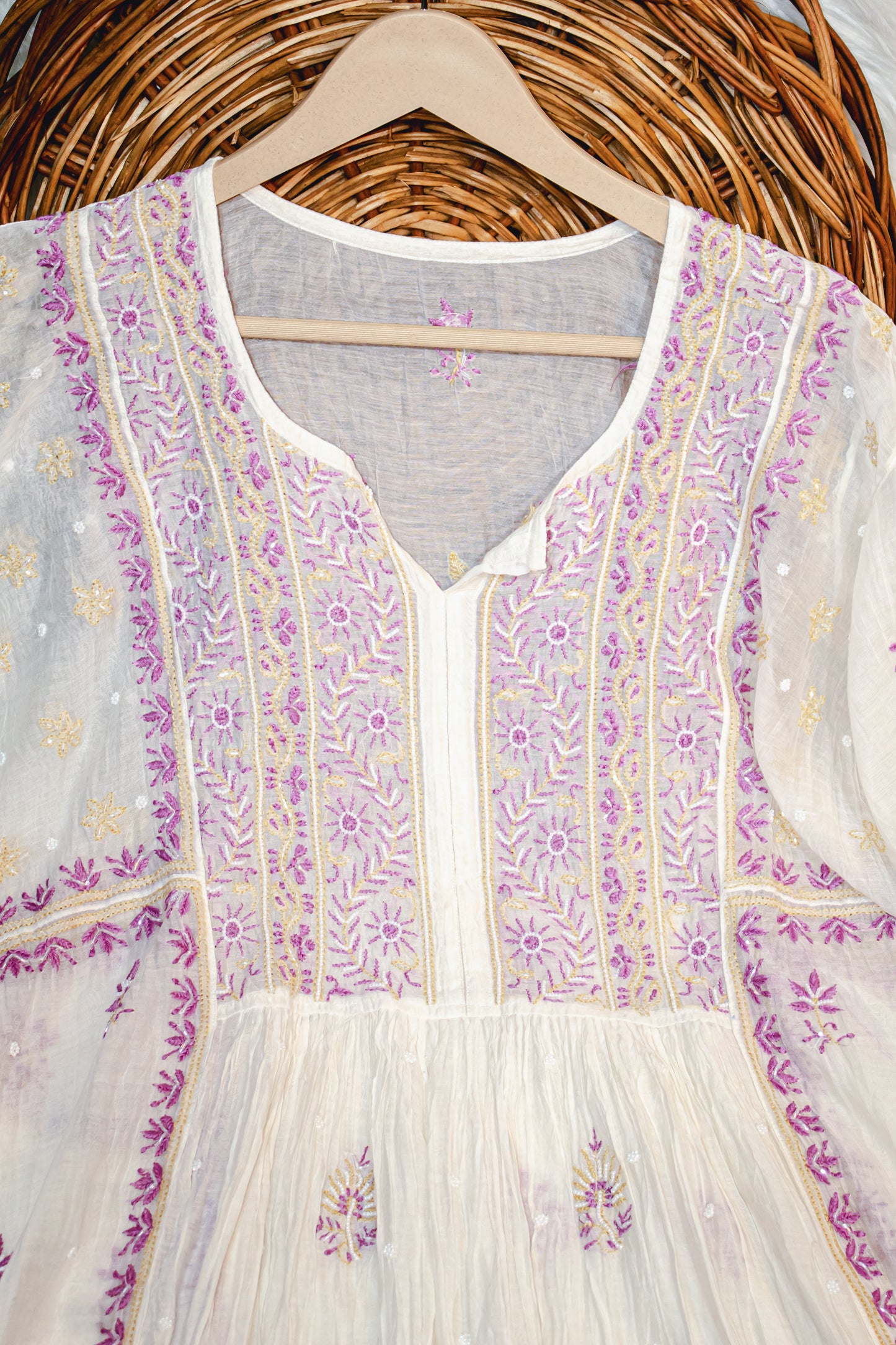 The Chikankari Story Pure Mulmul Chanderi Semi-Stitched Frock Gown with Dupatta: Fine Chikankari Hand Embroidery, Contrast Bakhia Work, and Moti Cut Dana Highlights having 3 meter kurta and 2.5 meter dupatta.