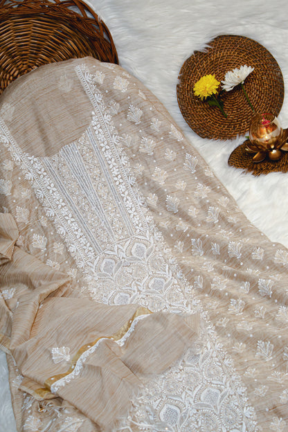 The Chikankari Story Unstitched Khadi Silk Chikankari Suit with Bakhia Hand Embroidery, Sequin, Moti, and Traditional Ghas Patti Work.