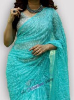 Georgette Saree with lakhnawi tepchi work hand embroidery all over. Matching blouse piece attached.